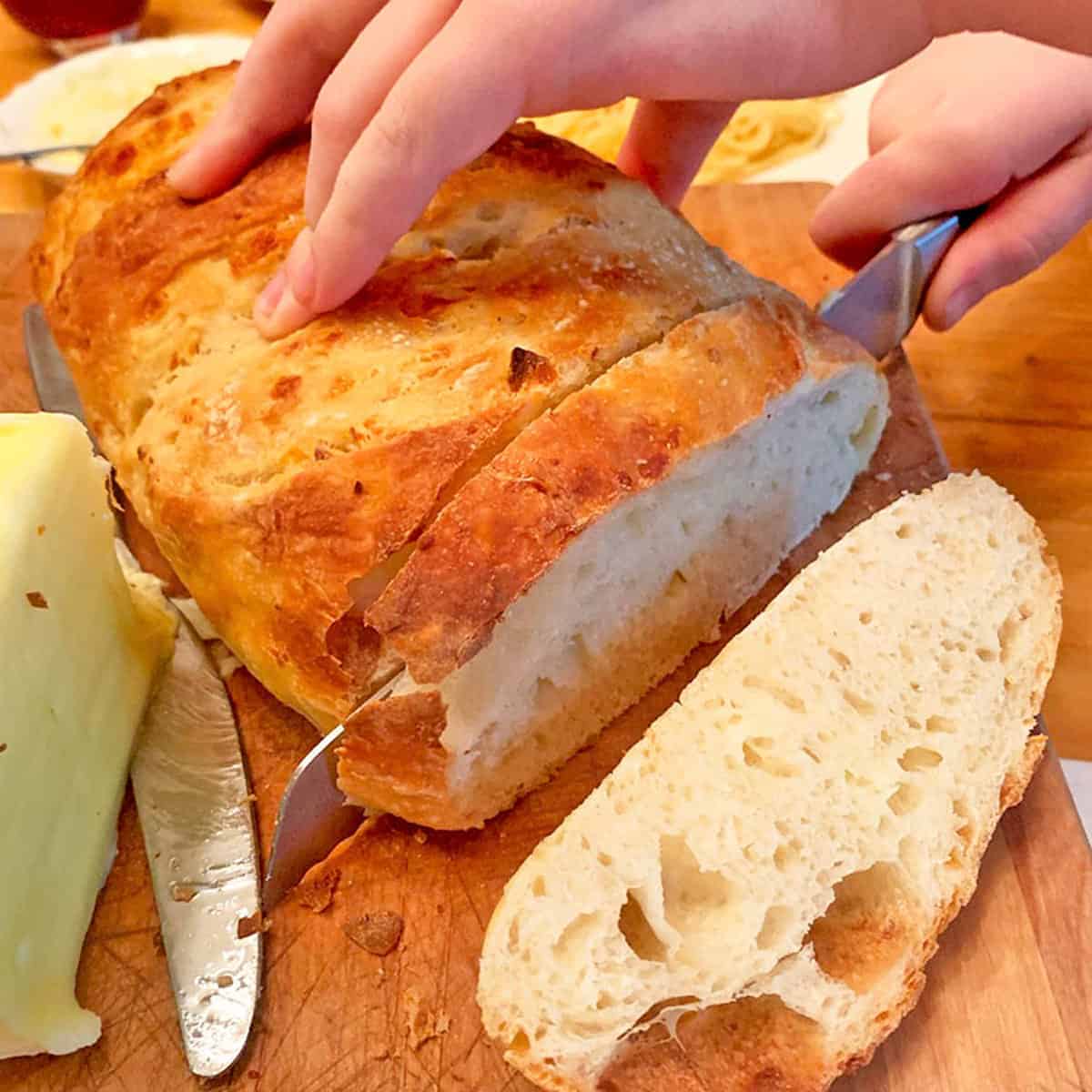 https://plattertalk.com/wp-content/uploads/2021/03/Slicking-crusty-bread.jpg